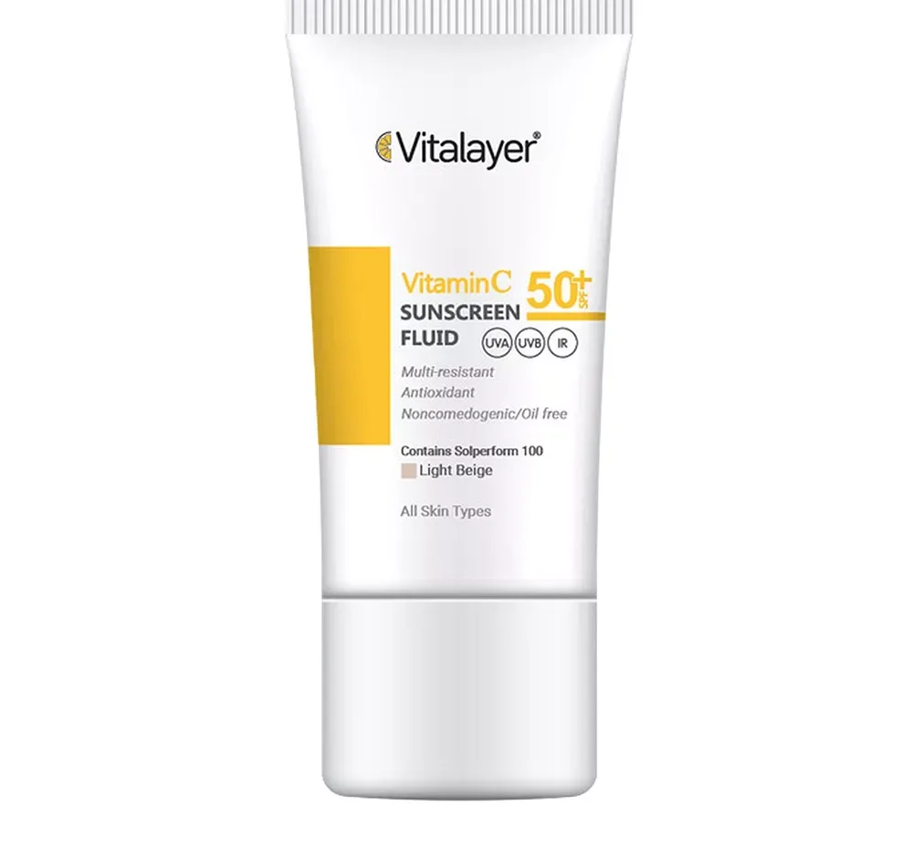 فلوئید ضدآفتاب رنگی ویتالیر، 50 SPF، مدل Vitamin C، مناسب انواع پوست تنالیته رنگ متوسط و حجم 50 میلی‌لیتر، ضد آب، محافظت کننده در برابر اشعه UVA، UVB، IR، آنتی‌اکسیدان، فاقد چربی و پارابن، ضد لک، آبرسان، دارای فرمولاسیون غیرکومدون‌زا، با ماندگاری 2 ساعته
